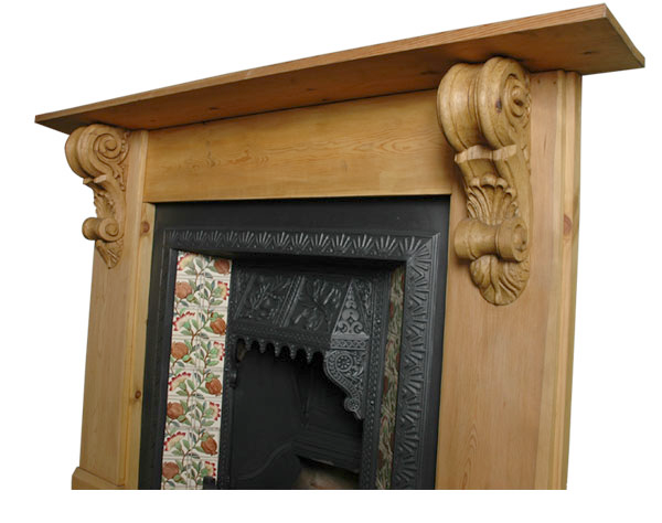 These large Classical architectural corbels (item code PN475) make impressive mantel supports above an old, tiled, fireplace.