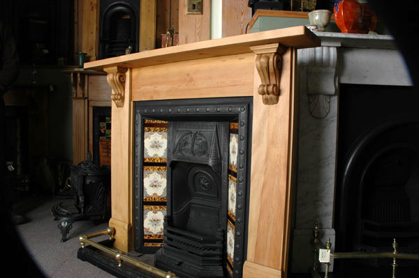 Teardrop corbels with integral capping (item code PN676) are used to great effect on this traditional pine fire surround.